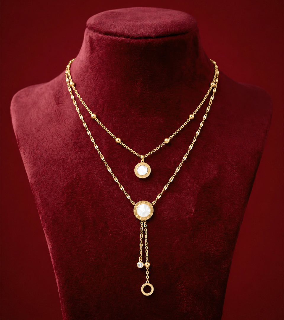 Elegant Roman Numeral Layered Necklace on burgundy jewellery bust