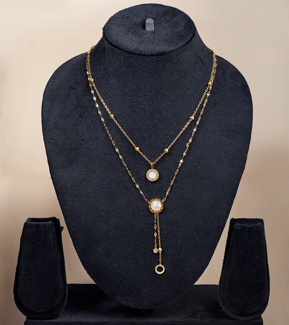Elegant Roman Numeral Layered Necklace flat lay on beige background