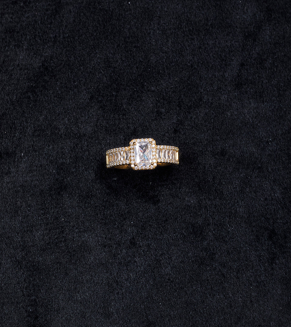 Premium Cushion-Cut Gold-Plated Finger Ring flat lay on beige background