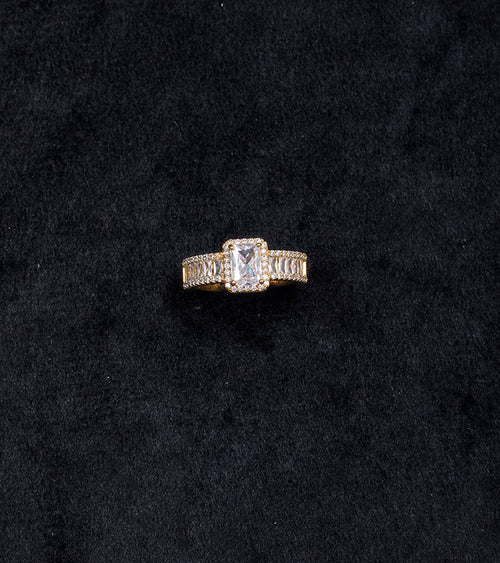 Premium Cushion-Cut Gold-Plated Finger Ring flat lay on beige background